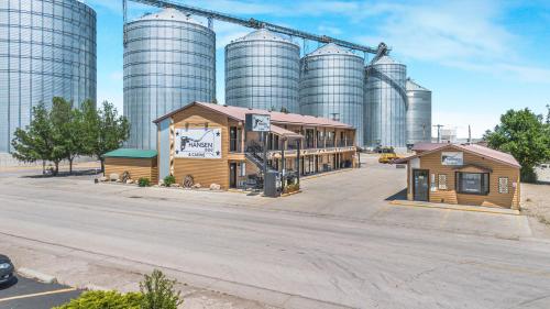 a train station in front of a large factory at Hansen Inn & Cabins in Wall