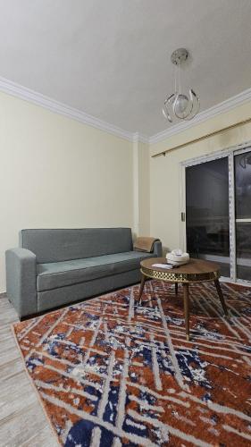 a living room with a couch and a coffee table at The Nest - Tiran View in Sharm El Sheikh
