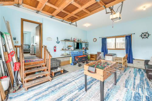 a living room with blue walls and wooden ceilings at Walk to Beach Dog-Friendly Home in Lincoln City in Lincoln City
