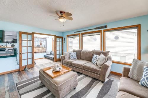 a living room with a couch and a table at Walk to Beach Dog-Friendly Home in Lincoln City in Lincoln City