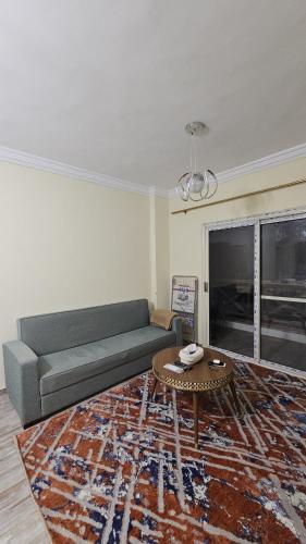 a living room with a couch and a coffee table at The Nest - Tiran View in Sharm El Sheikh