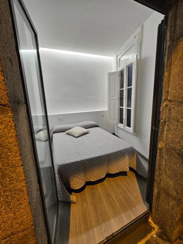 Ένα ή περισσότερα κρεβάτια σε δωμάτιο στο Piso céntrico en Vigo