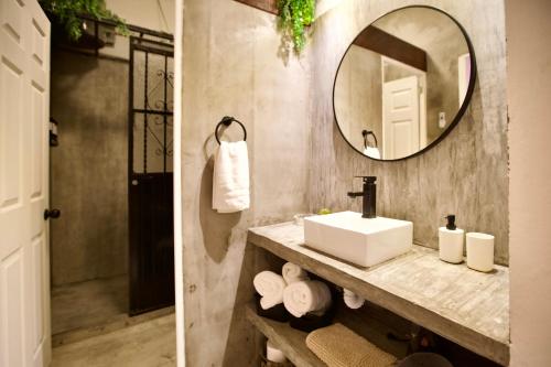 a bathroom with a sink and a mirror at Casa Verdejo - Zona Romantica in Puerto Vallarta