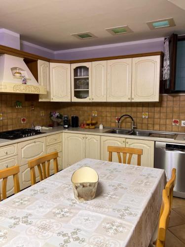 a kitchen with a table with a bowl on it at Casa vacanze Levata del sole in Porto Potenza Picena