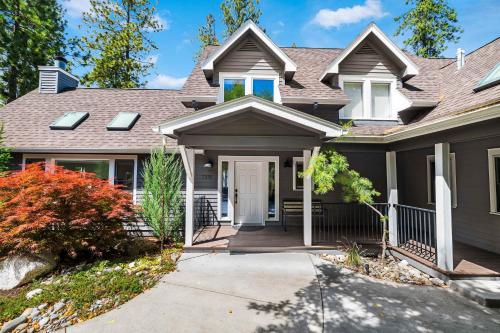 a house with a white door and a porch at Paradise Found in Coeur d'Alene
