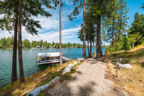 a boat is docked on the shore of a lake at Paradise Found in Coeur d'Alene