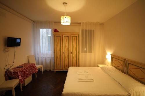 Ένα ή περισσότερα κρεβάτια σε δωμάτιο στο Cà Dolce Vita