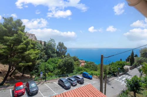 a bunch of cars parked in a parking lot at Villa with Panoramic Sea View & Private Pool Roquebrune-Cap-Martin & Monaco in Roquebrune-Cap-Martin