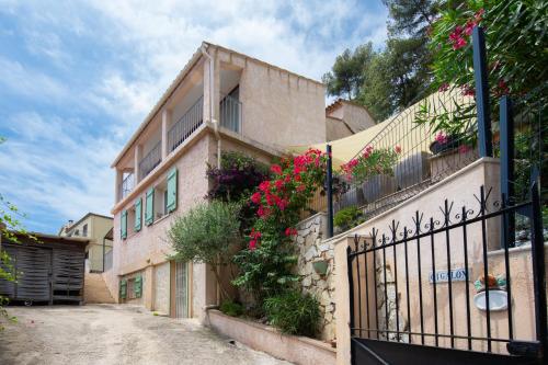 a house with flowers on the side of it at Villa with Panoramic Sea View & Private Pool Roquebrune-Cap-Martin & Monaco in Roquebrune-Cap-Martin