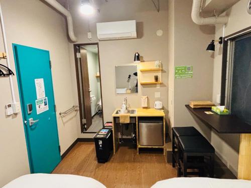 a hospital room with a sink and a desk at Wasabi Mita Hotel - Vacation STAY 84674v in Tokyo