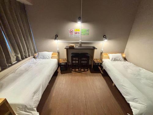 a hospital room with two beds and a table at Wasabi Mita Hotel - Vacation STAY 84674v in Tokyo