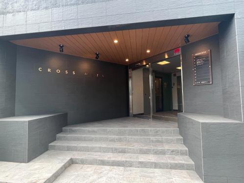 a building with stairs in front of a store at Wasabi Mita Hotel - Vacation STAY 84702v in Tokyo