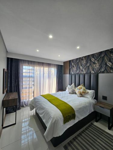 Ένα ή περισσότερα κρεβάτια σε δωμάτιο στο Midlands Guest House