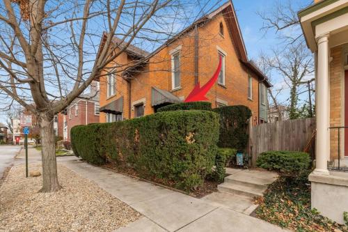 a brick house with a bush in front of it at Entire Duplex - 2 Units in Milo