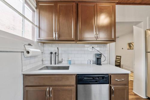 a kitchen with wooden cabinets and a sink at Entire Duplex - 2 Units in Milo