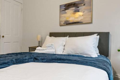 a bedroom with a bed with white pillows at Entire Duplex - 2 Units in Milo