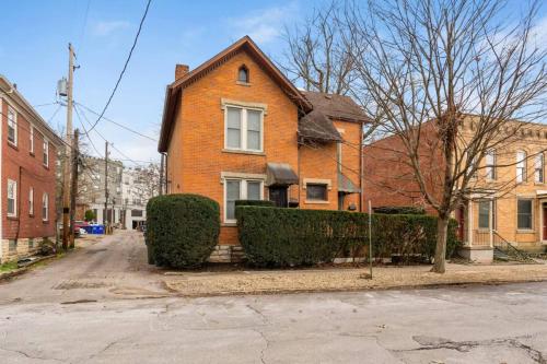 a brick house with bushes in front of a street at Entire Duplex - 2 Units in Milo