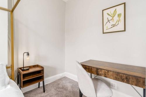 a desk in a room with a bed and a table at Entire Duplex - 2 Units in Milo