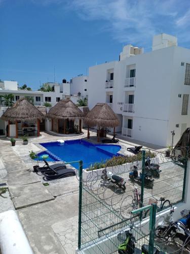 a view of a resort with a swimming pool at Deptos Alma in Tulum