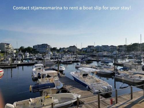 a bunch of boats are docked in a marina at Condo in St James in Southport - Great amenities in Southport