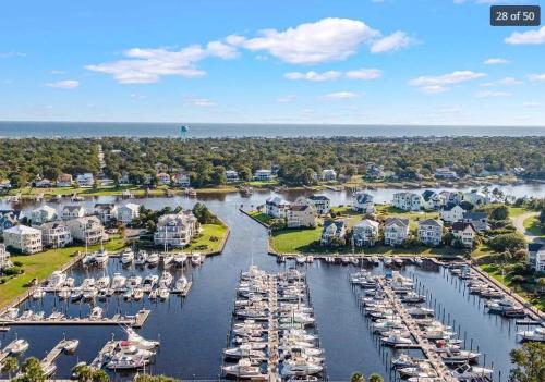 an aerial view of a marina with boats in the water at 1 bedroom condo in St James in Southport - great amenities in Southport