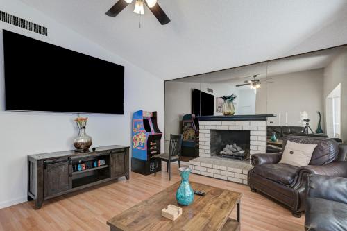a living room with a large flat screen tv at Strip-side Villa, 6 Beds, Pool, Mini Golf, Karaoke in Las Vegas