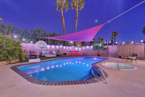 a swimming pool in a backyard at night at Strip-side Villa, 6 Beds, Pool, Mini Golf, Karaoke in Las Vegas