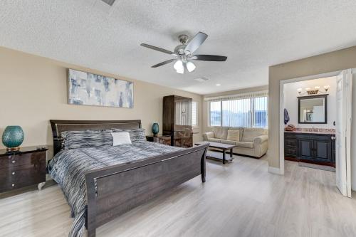 a bedroom with a bed and a ceiling fan at Strip-side Villa, 6 Beds, Pool, Mini Golf, Karaoke in Las Vegas