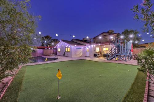 a house with a putting green with a miniature golf course at Strip-side Villa, 6 Beds, Pool, Mini Golf, Karaoke in Las Vegas