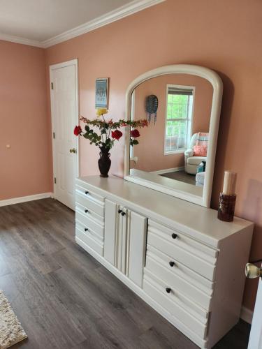 a large mirror on a dresser in a room at Lake House in Phil Campbell