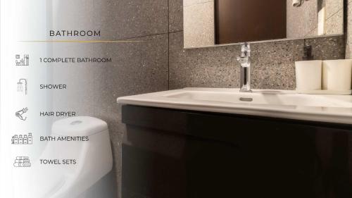 a bathroom with a sink and a toilet at 305 Dwntn Apt With AC and balconies fits 6 Rooftop in Mexico City
