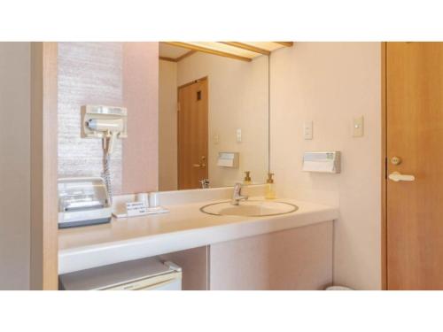 a bathroom with a sink and a mirror at Ouka no sato La-Foret Shobara - Vacation STAY 67406v in Shōbara