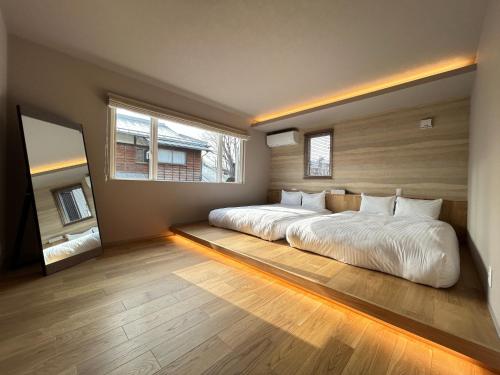 Un pat sau paturi într-o cameră la Fuji Petel - Vacation STAY 03660v