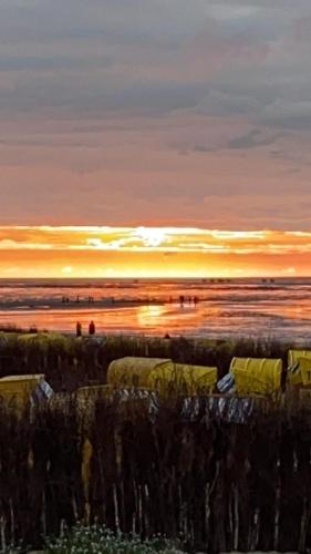 a painting of a sunset at the beach at Nordsee 04 in Cuxhaven