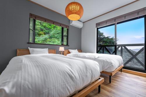 Un pat sau paturi într-o cameră la Calm Villa Atami - Vacation STAY 24438v
