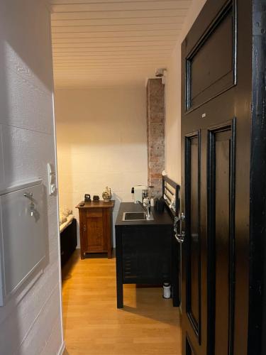 a bathroom with a sink and a sink at Ålesund Central Apartment in Ålesund