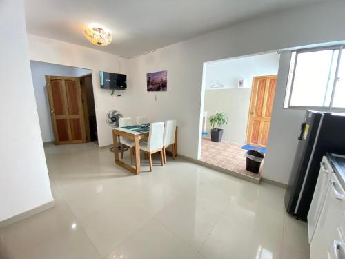 a living room with a table and a dining room at Apartamento la Isla 2-Coveñas in Coveñas