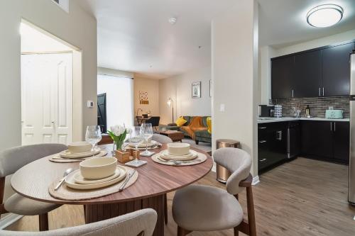 a dining room and living room with a table and chairs at Modern 1bd apt in Marina del Rey w Free Parking in Los Angeles