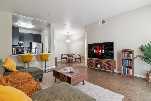 a living room with a couch and a tv at Modern 1bd apt in Marina del Rey w Free Parking in Los Angeles