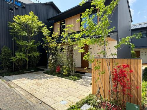 a house with a garden and a wooden fence at Shioyasuji Garden 447 - Vacation STAY 57033v in Sumoto