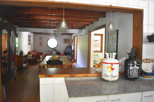 a kitchen and dining room with a counter top at Hostal Pando in Santa Cruz