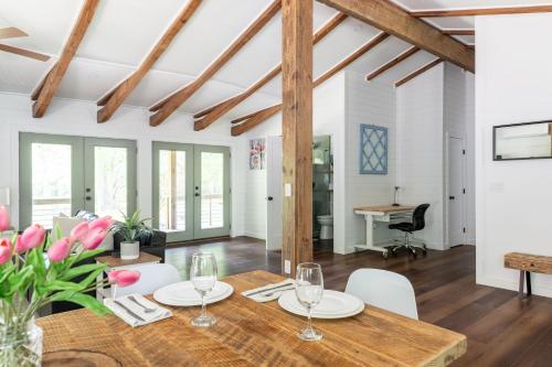 a dining room with a table and chairs at Tranquility Pond Cabin - Nature Retreat on 5 Acres in Buford