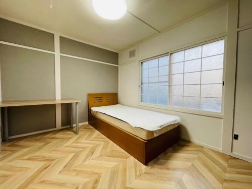 Postel nebo postele na pokoji v ubytování Sakura Kan - Vacation STAY 19675