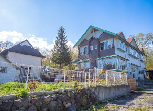 a house with a fence in front of it at Nasu First Villa - Vacation STAY 81161v in Nasu-yumoto