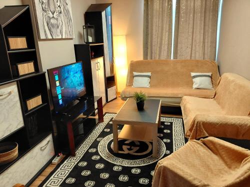 Televisyen dan/atau pusat hiburan di Sunny days Cozy apartment