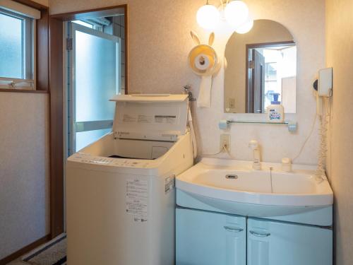 a washing machine and a sink in a bathroom at Nasu First Villa - Vacation STAY 81161v in Nasu-yumoto