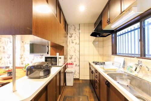 a kitchen with a sink and a counter top at Nagoya - House - Vacation STAY 19711 in Nagoya