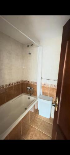 a bathroom with a bath tub and a sink at mar azul in Malpica