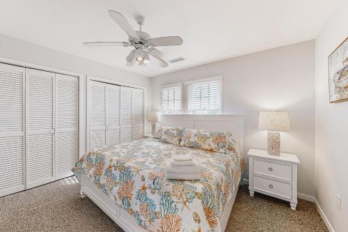 a bedroom with a bed and a ceiling fan at Zebrafish in Buxton