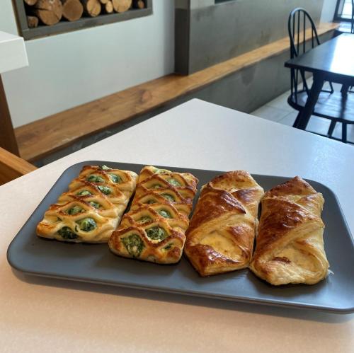four croissants on a plate on a table at Hotel Felix in Chicago
